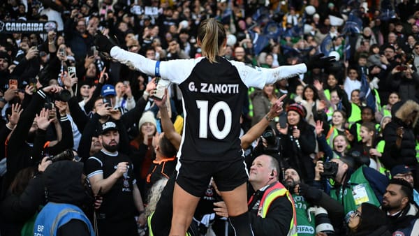Corinthians' captain and goalscorer, Zanotti, celebrating with the rowdy Corinthians fans after beating Gotham